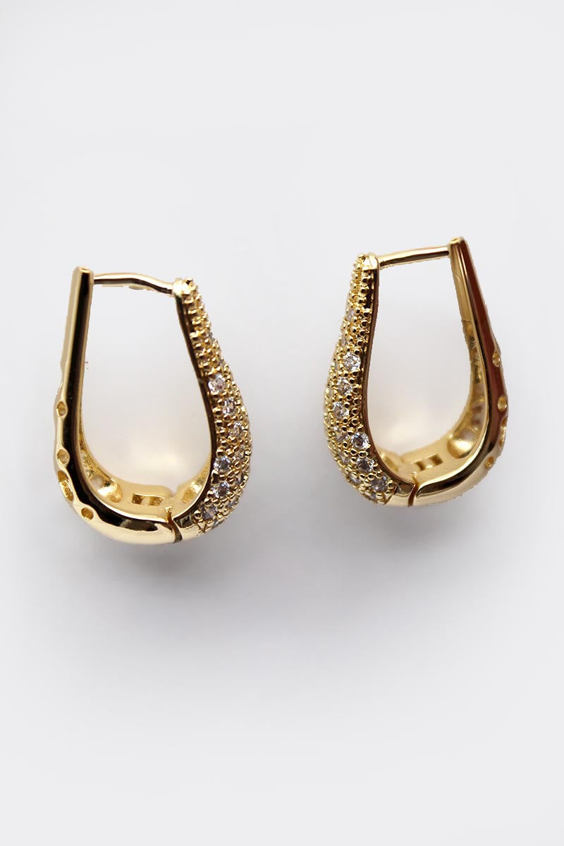 Gold hoop earrings with embedded stones on a white background