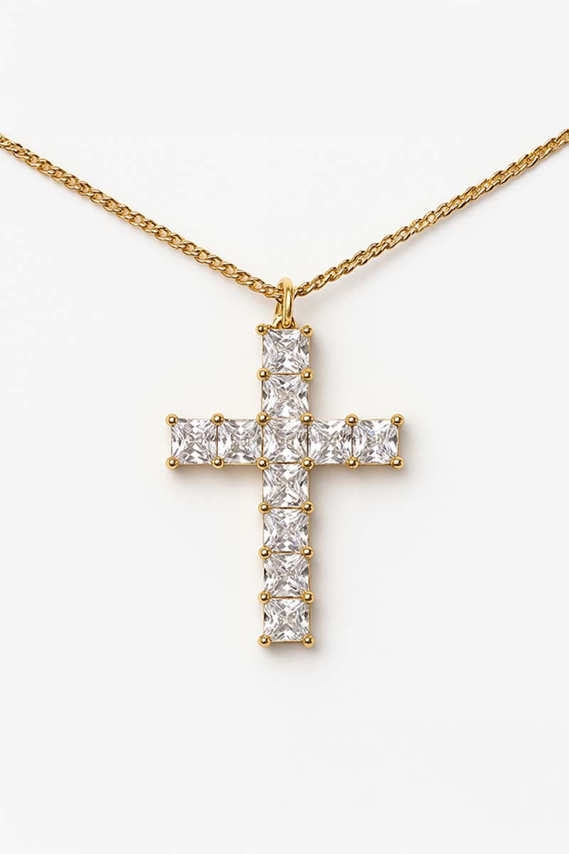 A gold-colored cross pendant necklace with princess-cut stones set in a row