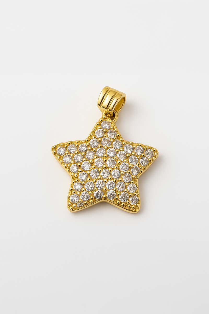A gold plated star-shaped pendant covered in radiant pavé crystals.