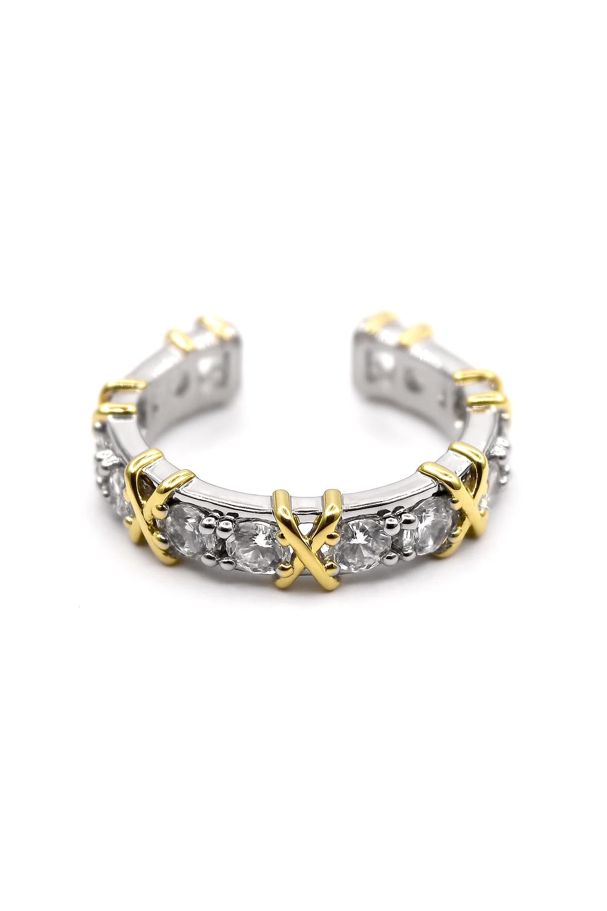 Gold and silver ring with clear gemstones on a white background