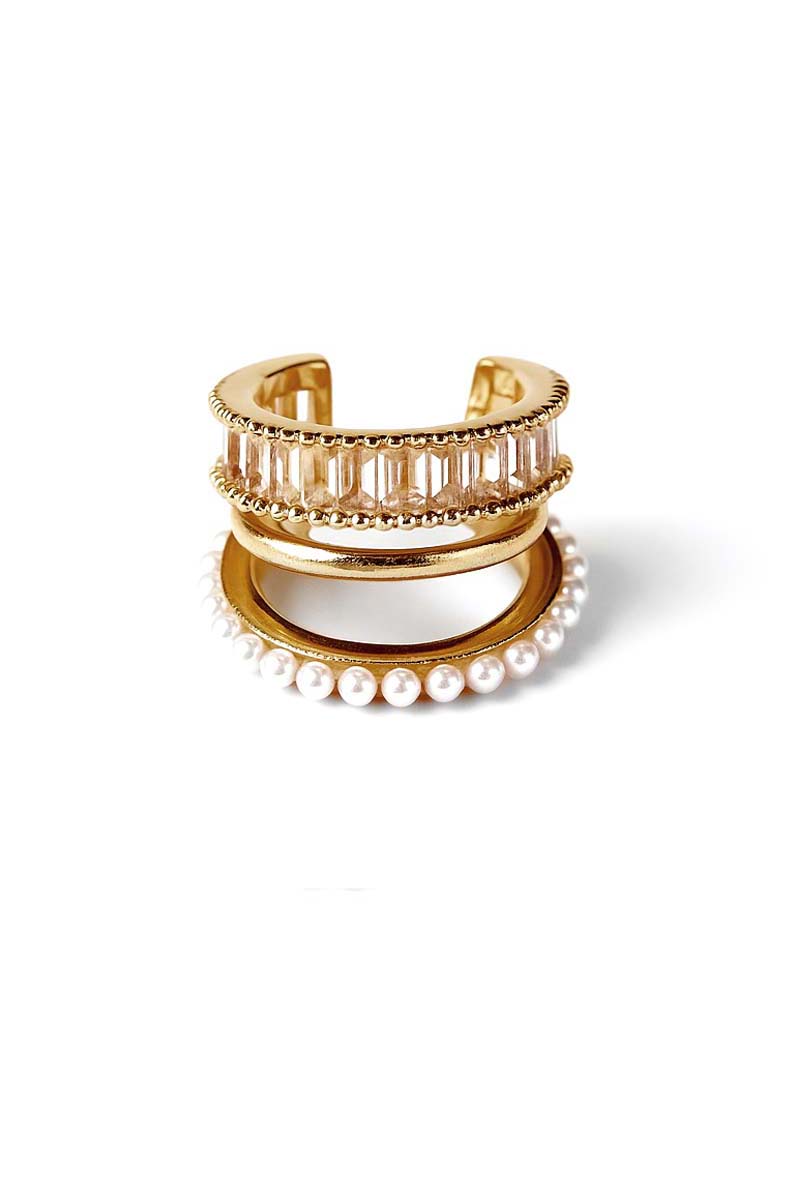 Gold and pearl earring on a white background and cubic zirconia